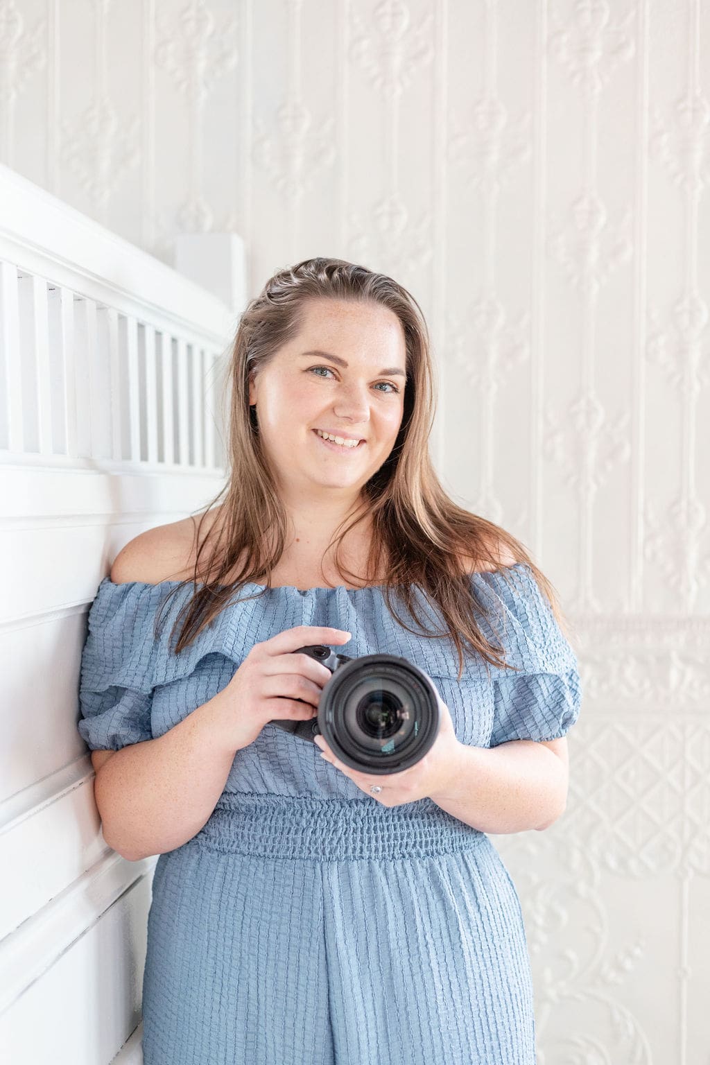 Woman holds camera and smiles | Lafayette Brand Photographer | Kayla Petrosky Photography